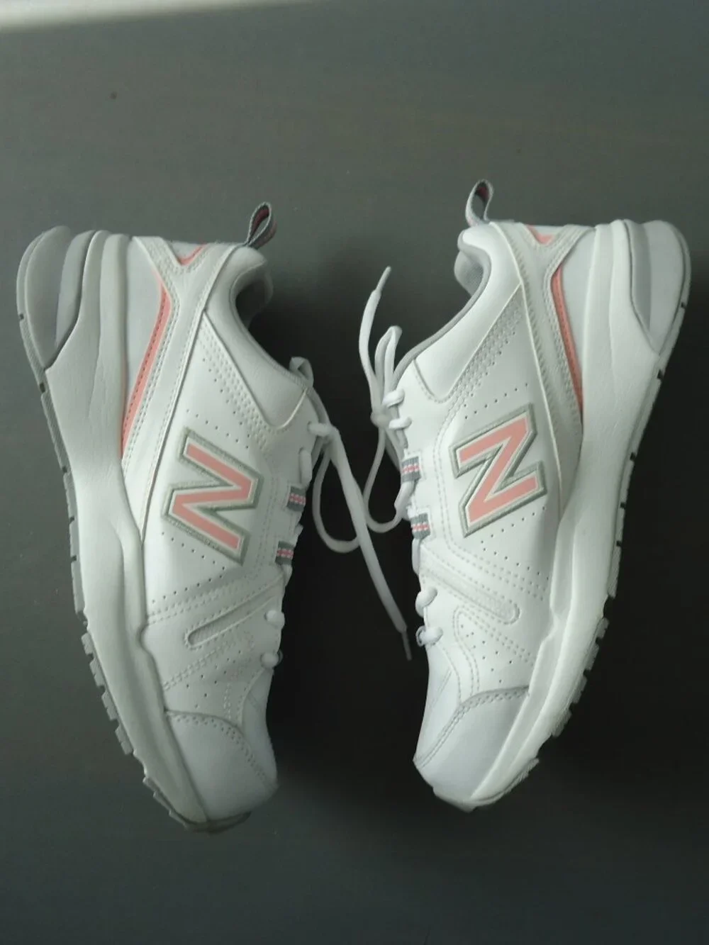 SIZE 9.5. D. New Balance women's white leather sneakers shoes.
